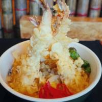 D-2. Shrimp Ten Don · Japanese style rice bowl. Shrimp tempura and eggs cooked in a sweet and salty broth and plac...