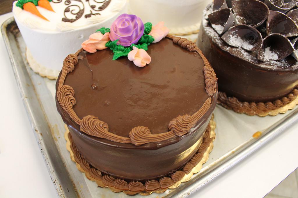 Death by Chocolate Cake · Chocolate cake, chocolate mousse filling, chocolate ganache.