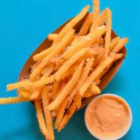 PARMESAN TRUFFLE FRIES · Tossed in parmesan cheese and truffle oil + served with an optional side of chipotle aioli.