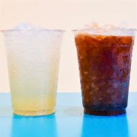 FOUNTAIN COLAS + ICED TEA · Maine Root fountain colas and freshly brewed iced tea served in a 16oz cup.