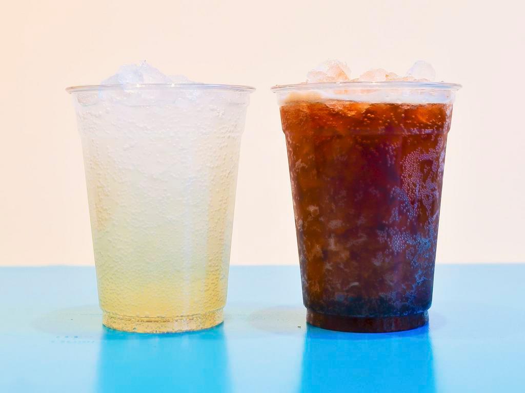 FOUNTAIN COLAS + ICED TEA · Maine Root fountain colas and freshly brewed iced tea served in a 16oz cup.