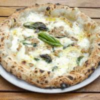 Porcini e Tartufo Pizza · Homemade mozzarella, porcini mushrooms, Parmigiano Reggiano and truffle oil. White pizza wit...
