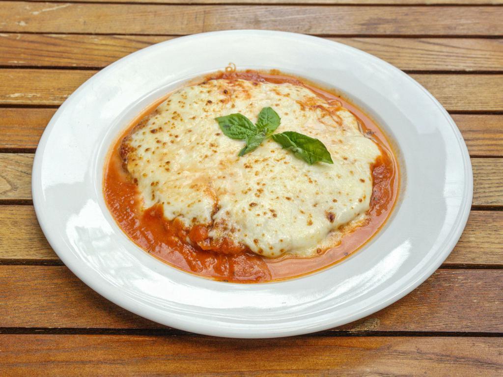Pollo Parmigiana · Chicken cutlet, tomato sauce, homemade mozzarella and Parmigiano Reggiano. 