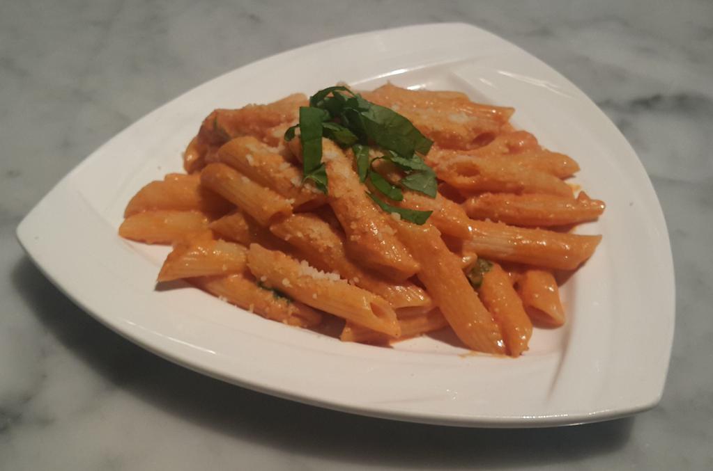 Penne alla vodka · Penne pasta in a blush cream sauce with prosciutto. Add fresh burrata ball on top or chicken cutlet for an additional charge.