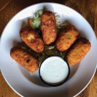 Taproom Poppers · Shredded smoked chicken with jalapeño, pepper jack, cream cheese, Sriracha, breaded and frie...
