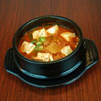 14. Kimchi Jjigae · Spicy. Kimchi soup with pork and tofu.