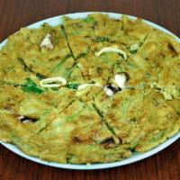 44. Haemul Pajeon · Mixed seafood pancake with green onions. No rice and side dishes.
