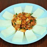 47. Tofu-Kimchi · Spicy. Kimchi and pork stir-fried with plain sliced tofu served on the side.