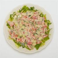 Jerusalem Salad · A salad made from diced tomatoes, cucumber, and parsley dressed with tahini sauce.