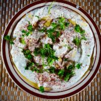 Labneh · Yogurt dip with onion and cucumber. Serve with Pita Bread.