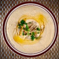 Hummus · Fresh cooked, mashed chickpeas blended with tahini, lemon juice, and garlic. Serve With Pita...