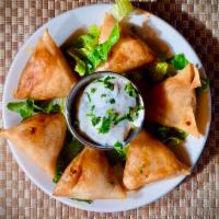 Samosa  · 6 pieces of Phyllo dough stuffed with pureed vegetables 