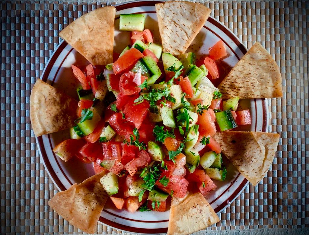 Mediterranean Salad · Tossed tomatoes, cucumbers, onions, parsley, topped with olive oil and lemon. Served with pocket pita bread.