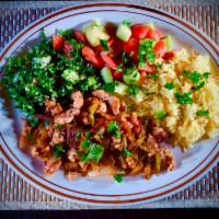 13. Lamb and Chicken Special · Mixed pieces of chicken and lamb sauteed with onions and fresh tomatoes seasoned with 7 spic...