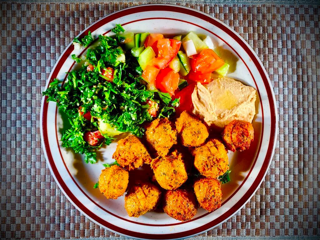 14. Falafel · Ground garbanzo beans, potatoes, garlic, parsley, onions, spices, fried and served with Full size house salad.