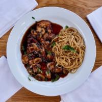 Chicken Marsala · Sauteed in sweet marsala wine with mushrooms, served with spaghetti.