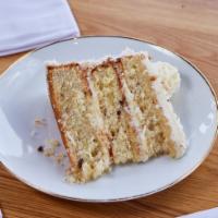 Italian Cream Cake · Moist buttermilk cake, filled with shredded coconut and toasted pecans. Frosted with a whipp...