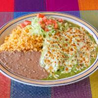 Enchiladas Verdes · Three corn tortillas with in tomatillo sauce. Entrees are served with Mexican rice and refri...
