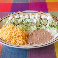Flautas · Chicken breast, crispy tacos in a green tomatillo sauce, refried beans and sour cream. Entre...