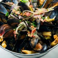 Mussels Over Fries · roasted poblano, red onion, lemon wine broth & garlic butter, fries, and 3 shrimp.