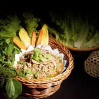 Larb Duck Pakxe · Pakxe style spicy duck lettuce wrap, toasted ground rice and soft herbs.