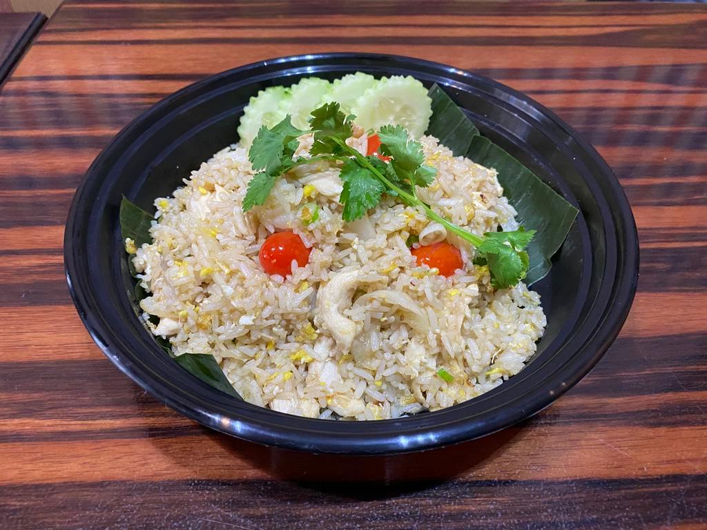 Classic Chicken Fried Rice · Classic chicken fried rice, egg, tomatoes, onion, and green onion
