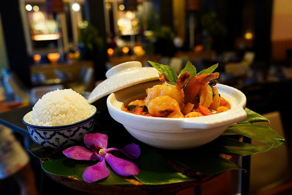 Totally Prawns · Coconut milk red curry, fresh tiger prawns, pineapple and lychee with toasted peanut. Served with jasmine rice.