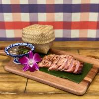 Grilled Pork Shoulder · Grilled Kurobuta pork shoulder + tamarind & toasted rice powder dressing W/ sticky rice