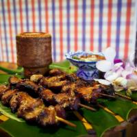 Moo Ping · Street style grilled marinated pork skewers + tamarind-chili dip W/ sticky rice