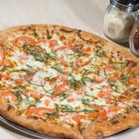 Margherita Pizza · Roma tomatoes and fresh basil with olive oil and garlic white sauce instead of marinara sauc...