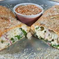Original Calzone · Spinach, grilled chicken and red onions. Baked with mozzarella and ricotta cheeses and serve...