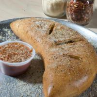 Custom Calzone · Pick any three toppings of your choice. Baked with mozzarella and ricotta cheeses and served...