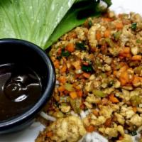 Lettuce Wraps · Sauteed with minced chicken, onions, celery, green onions, and garlic, topped with crispy ri...