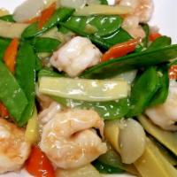 Shrimp with Snow Peas · Stir-fried with carrots, bamboo shoots, and water chestnuts in a garlic wine sauce.

