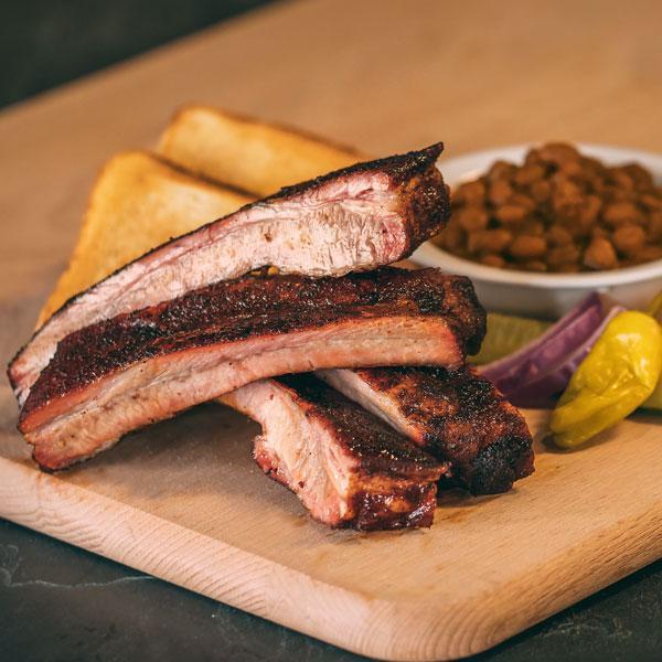 Running Back Dinner · 4 St. Louis style ribs with your choices of 2 sides. Includes Texas toast, pickles, peppers, red onions and bbq sauce.