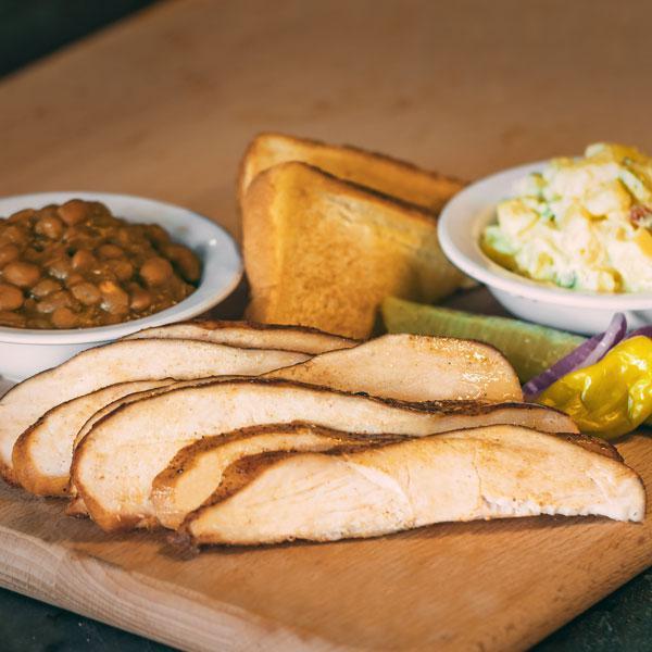 Smoked Chicken Dinner · Includes 2 Sides, Pickle, Pepper, Onion, Texas toast and BBQ Sauce