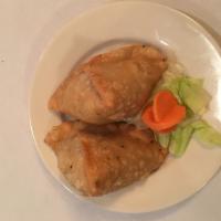 Vegetable Samosa · Crispy turnovers with seasoned potatoes and green peas. Served with versatile Indian homemad...