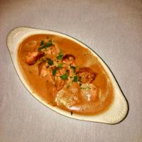 Chicken Makhani · A delicious preparation of tandoori chicken tikka cooked in a creamy tomato and butter sauce. 