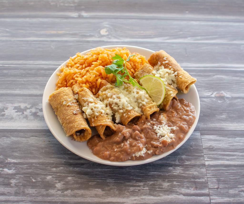 Taquitos Dorados · 3 rolled taquitos with chicken or shredded beef.