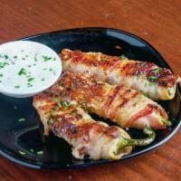 Jalapeno Bacon Wrapped Poppers · served with ranch.