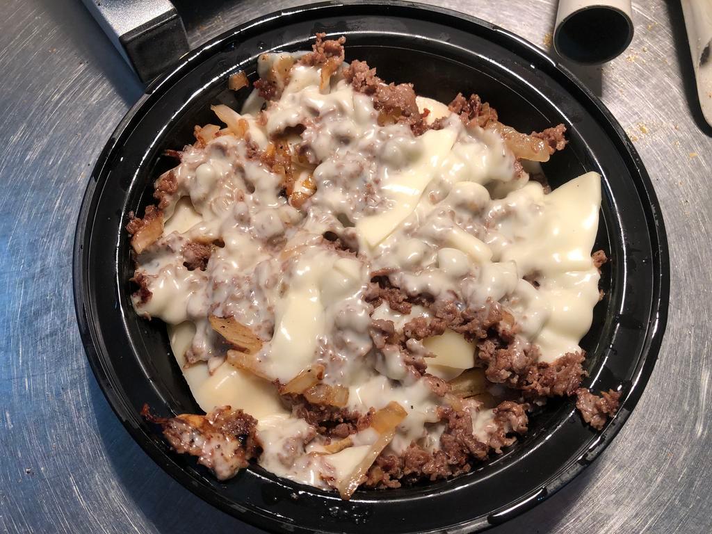 Cheesesteak Fry · Steak or chicken, onions and cheese over a bead of fries.