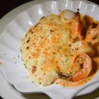 Coquille St Jacques · Shrimp and scallops in mustard cream sauce over mashed potatoes.
