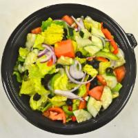 Garden Salad · Romaine lettuce, tomatoes, onions, black olives, cucumbers and mixed peppers. Served with br...