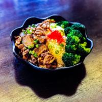 Braised Chicken Rice · Chicken, shitake mushrooms, ginger, broccoli over steam rice.