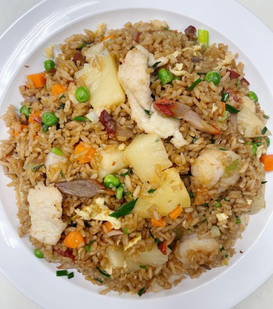 Pineapple Fried Rice · Cooked with BBQ pork, shrimp, and chicken.