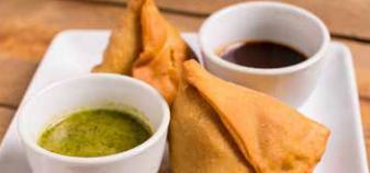 F12. Vegetable Samosa · 2 Crispy triangle pastries filled with fresh potato and spices. Vegan.