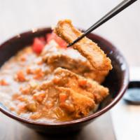 Curry Tonkasu Rice Bowl · Fried premium pork with house special curry sauce.