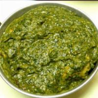 4. Chicken Saag · Boneless chicken cooked in creamed spinach and spices. Served with rice.