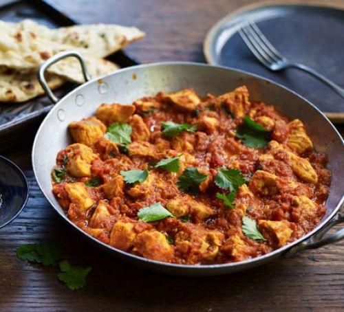 7. Chicken Madras · Chicken cubes cooked with fresh tomatoes, garlic and house blended medium spicy sauce. Served with rice.