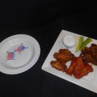Fiery Wing Trio · Buffalo, Jamaican jerk, melee BBQ, and blue cheese dressing.